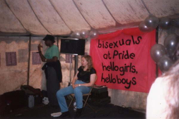 LGBT Pride 96 - Sue George's talk with BSL interpreter in front of the 'bisexuals at Pride, hello girls, hello boys' banner