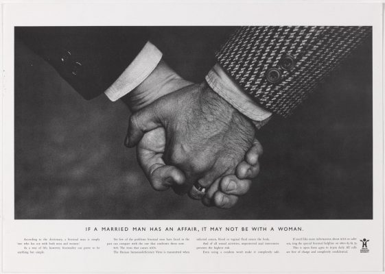 The first HEA 'hands' ad - close-up photo of two white middle class men holding hands