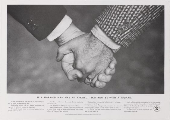 The HEA's 'hands' ad - close up photo of two middle class men holding hands, with the strapline 'If a married man has an affair, it may not be with a woman'